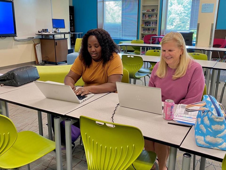 Aisha Banks (left) and Sharon Schuster came in July 3 to start planning their second-grade lessons at Renaissance West STEAM Academy.