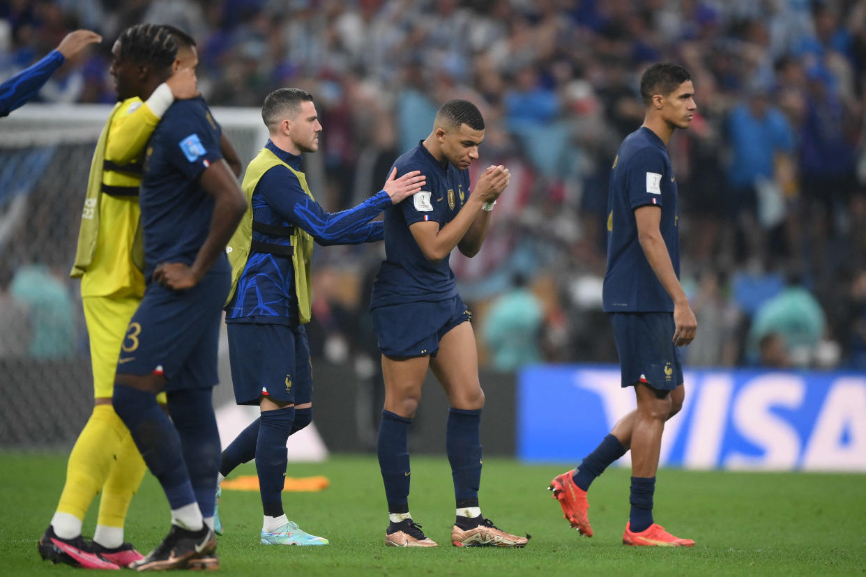 France's forward #10 Kylian Mbappe and teammates react after losing in the penalty shoot-out of the Qatar 2022 World Cup football final match between Argentina and France at Lusail Stadium in Lusail, north of Doha on December 18, 2022. (Photo by FRANCK FIFE / AFP)