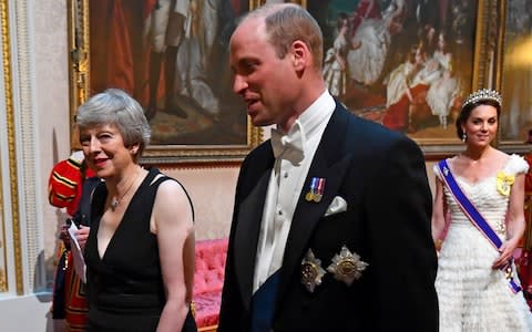 Prime Minister Theresa May (L) walks with Britain's Prince William, Duke of Cambridge  - Credit: Victoria Jones / POOL / AFP