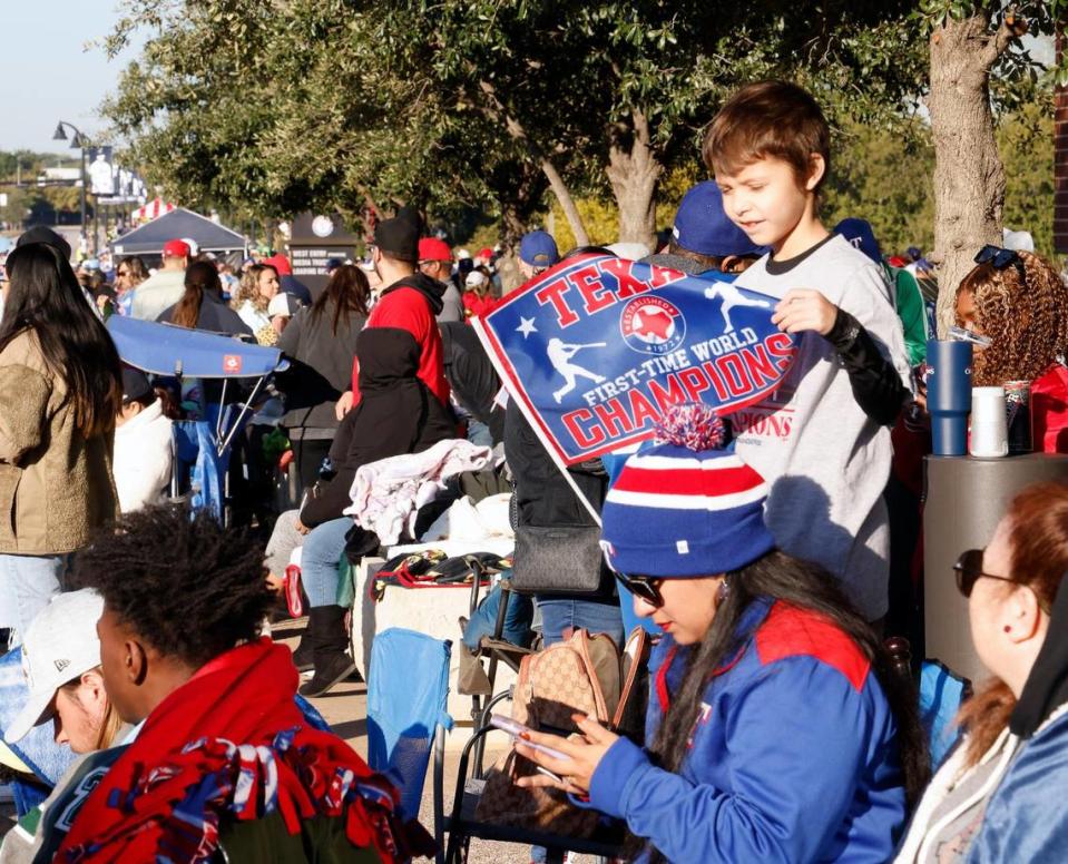 Ian Benson, 7, waits for the start of the Texas Rangers World Series Parade in Arlington, Texas, Friday, Nov. 03, 2023. Benson broke his perfect attendance record at a Mesquite school to attend the parade. (Special to the Star-Telegram Bob Booth)