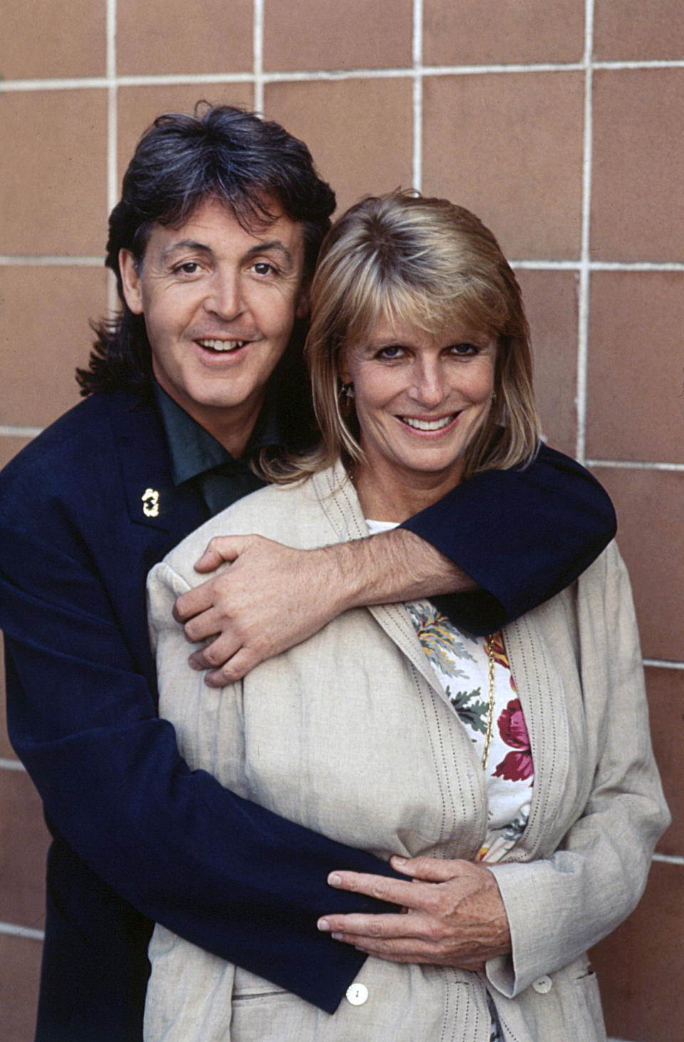 British singer-songwriter and musician Paul McCartney hugging his wife Linda Eastman. 1989 (Photo by Rino Petrosino/Mondadori Portfolio via Getty Images)