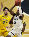 Michigan State guard Rocket Watts (2) attempts a shot during the second half of an NCAA college basketball game against Michigan, Sunday, March 7, 2021, in East Lansing, Mich. (AP Photo/Carlos Osorio)