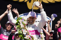 Helio Castroneves of Brazil celebrates after winning the Indianapolis 500 auto race at Indianapolis Motor Speedway in Indianapolis, Sunday, May 30, 2021. (AP Photo/Michael Conroy)