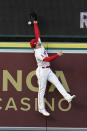 Los Angeles Angels center fielder Taylor Ward leaps but can't catch a home run ball from San Francisco Giants' Mauricio Dubon during the second inning of a baseball game Tuesday, June 22, 2021, in Anaheim, Calif. (AP Photo/Marcio Jose Sanchez)