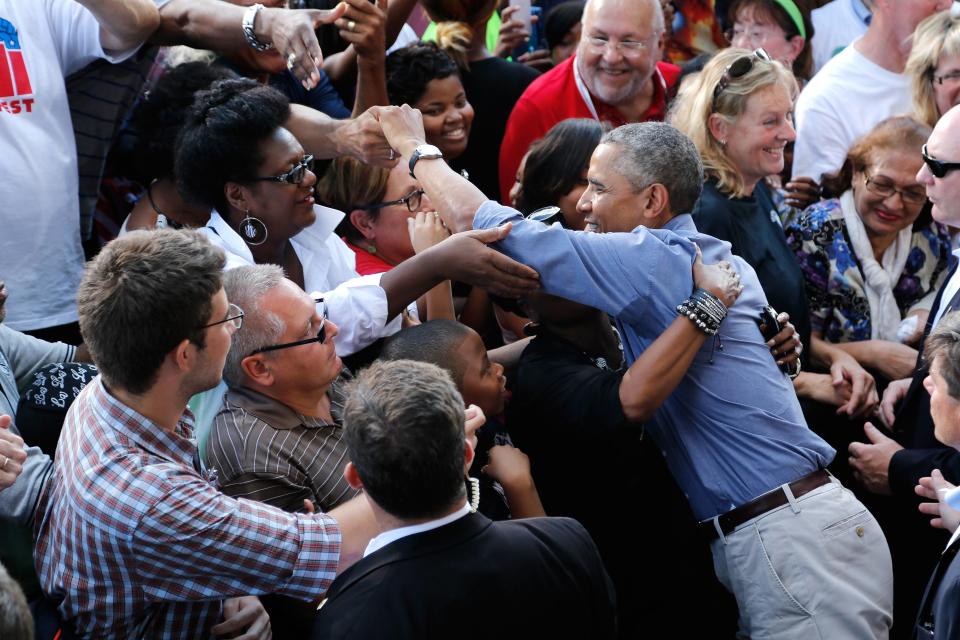 U.S. President Barack Obama greets people in the crowd after delivering remarks at Laborfest 2014 at Maier Festival Park in Milwaukee, Wisconsin September 1, 2014. REUTERS/Jonathan Ernst (UNITED STATES - Tags: POLITICS BUSINESS EMPLOYMENT)