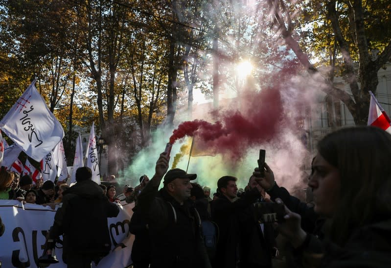 Opposition supporters take part in a rally to protest against the government and demand an early parliamentary election in Tbilisi