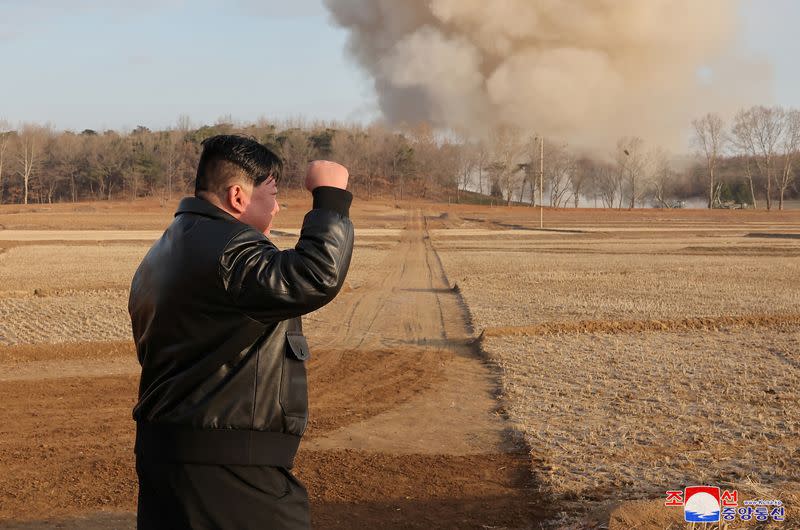 North Korean leader Kim Jong Un guides a training of the fire division