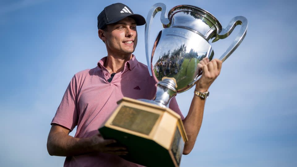 Aberg toasts with the European Masters trophy after victory in Crans Montana, Switzerland. - Fabrice Coffrini/AFP/Getty Images