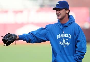 Manager Don Mattingly gives instructions during batting practice on April 13 in San Francisco. The Dodgers went 13-14 in the month