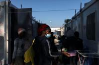 A migrant stands in the Mavrovouni camp on the island of Lesbos