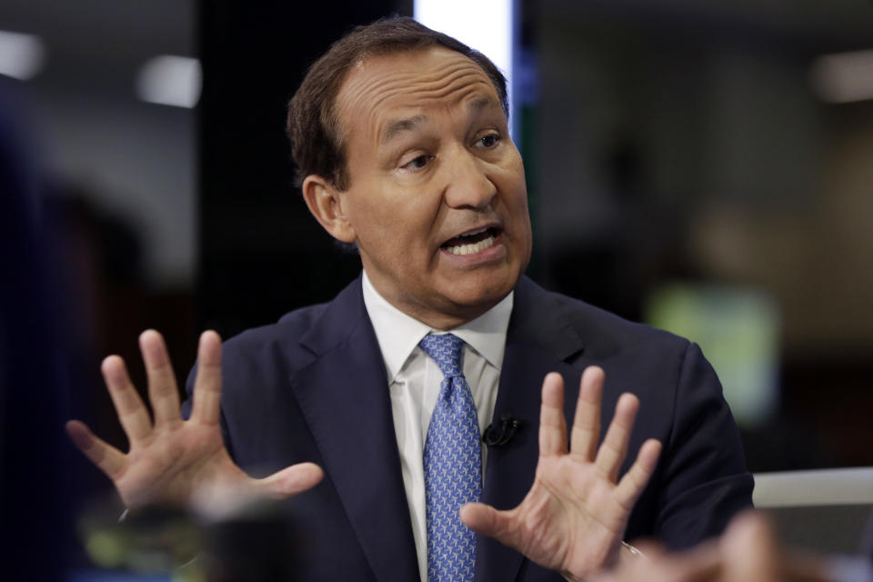 FILE - In this Jan. 24, 2018 file photo, United Airlines CEO Oscar Munoz is interviewed on the floor of the New York Stock Exchange. Munoz is stepping down from his post and will become executive chairman. The airline said Thursday, Dec. 5, 2019, that President J. Scott Kirby will be its new CEO. Munoz will become executive chairman in May 2020. (AP Photo/Richard Drew, File)