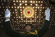 <p>A Chinese military band conductor leads the band at the end of the opening session of the annual National People’s Congress in Beijing’s Great Hall of the People on March 5, 2018. (Photo: Ng Han Guan/AP) </p>