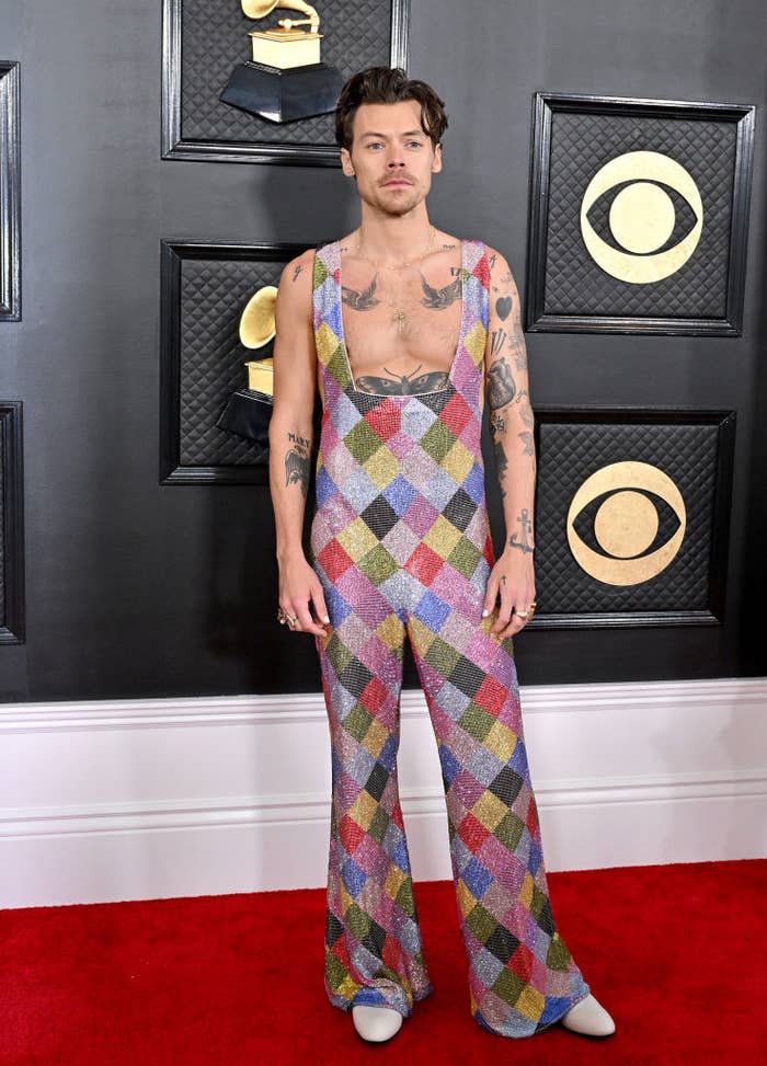 Harry Styles in a colorful jumpsuit on the red carpet