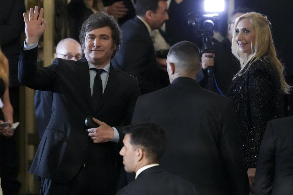 Argentina's newly sworn-in President Javier Milei, left, and his sister Karina arrive to the Colon Theater for a gala event in Buenos Aires, Argentina, Sunday, Dec. 10, 2023. (AP Photo/Matilde Campodonico)