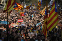 <p>Protesters with Catalan flags take part in a rally in Barcelona, Spain, Friday, Oct. 27, 2017. Catalonia’s parliament on Friday will resume debating its response to the Spanish government’s plans to strip away its regional powers to halt it pushing toward independence. (Photo: Emilio Morenatti/AP) </p>