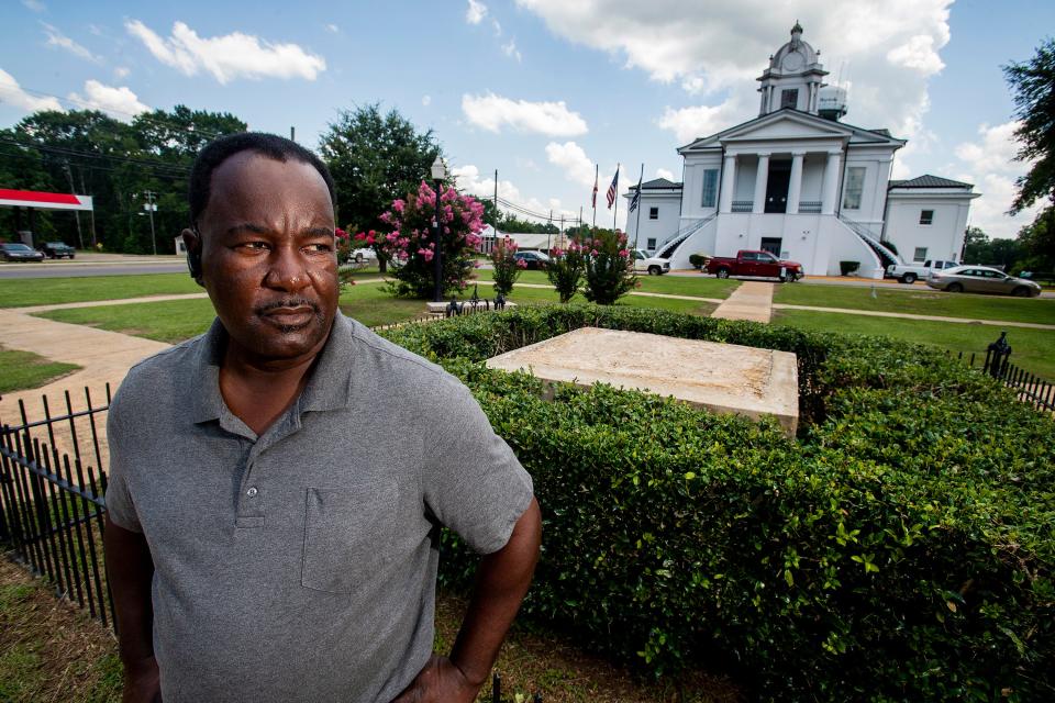 Lowndes County Commissioner Robert Harris stands near the spot where a Confederate monument once stood in front of the county courthouse in Hayneville, Ala., on July 17, 2020.