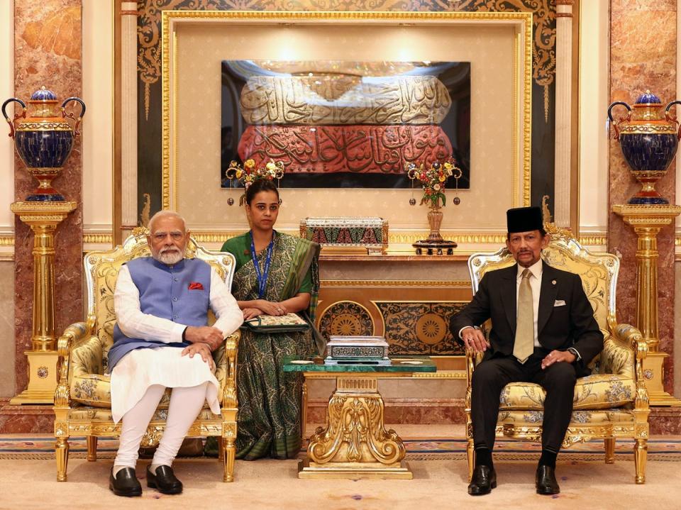 India’s prime minister Narendra Modi (L) and Brunei Sultan Hassanal Bolkiah (R) pose for pictures prior to a meeting at Istana Nurul Iman in Bandar Seri Begawan on 4 September 2024 (AFP via Getty Images)