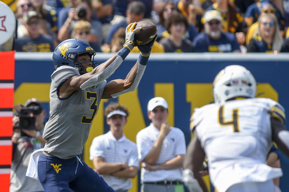 West Virginia wide receiver Kaden Prather (3) makes a catch against Towson during the first half of an NCAA college football game in Morgantown, W.Va., Saturday, Sept. 17, 2022. (AP Photo/William Wotring)