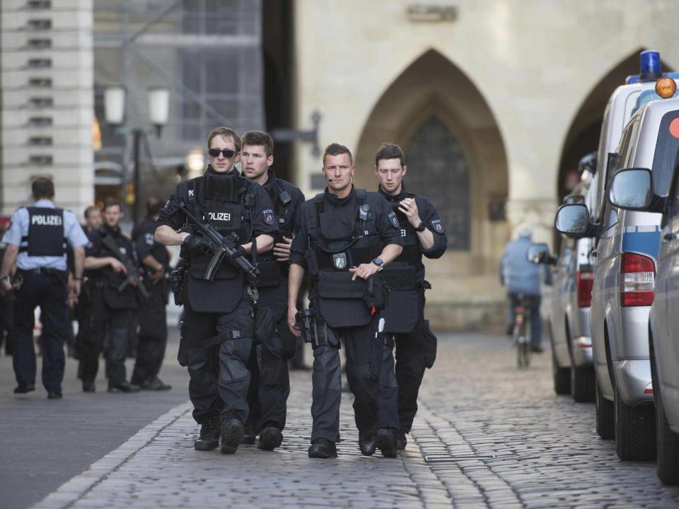 Police guard the streets of downtown Münster‬‬ following the crash (Bernd Thissen/dpa via AP)