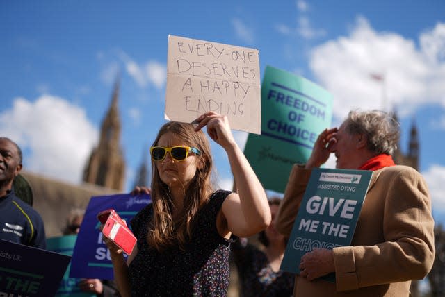 Campaigners gathered outside Parliament ahead of the debate (Jordan Pettitt/PA)