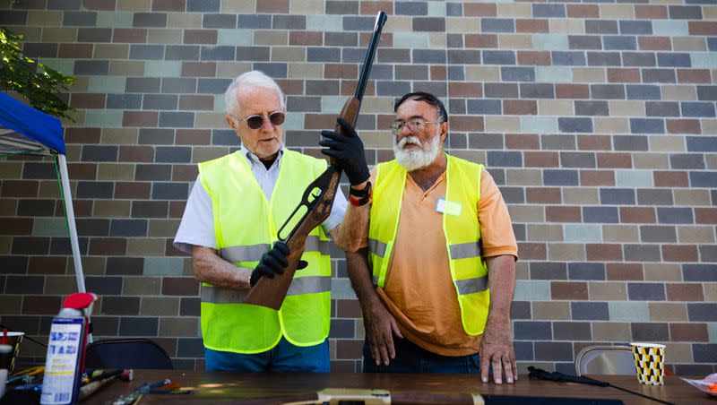 Steve Ritchey, right, and Bruce Travis, left, prepare to dismantle guns during an event disarming firearms at the Christ United Methodist Church in Salt Lake City on June 10, 2023.