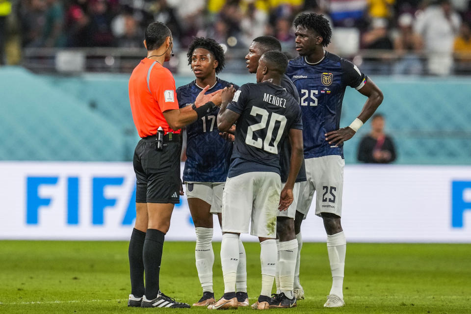 Ecuador players talk to Algerian referee Mustapha Ghorbal, left, after he disallowed a goal during the World Cup group A soccer match between Netherlands and Ecuador, at the Khalifa International Stadium in Doha, Qatar, Friday, Nov. 25, 2022. (AP Photo/Themba Hadebe)