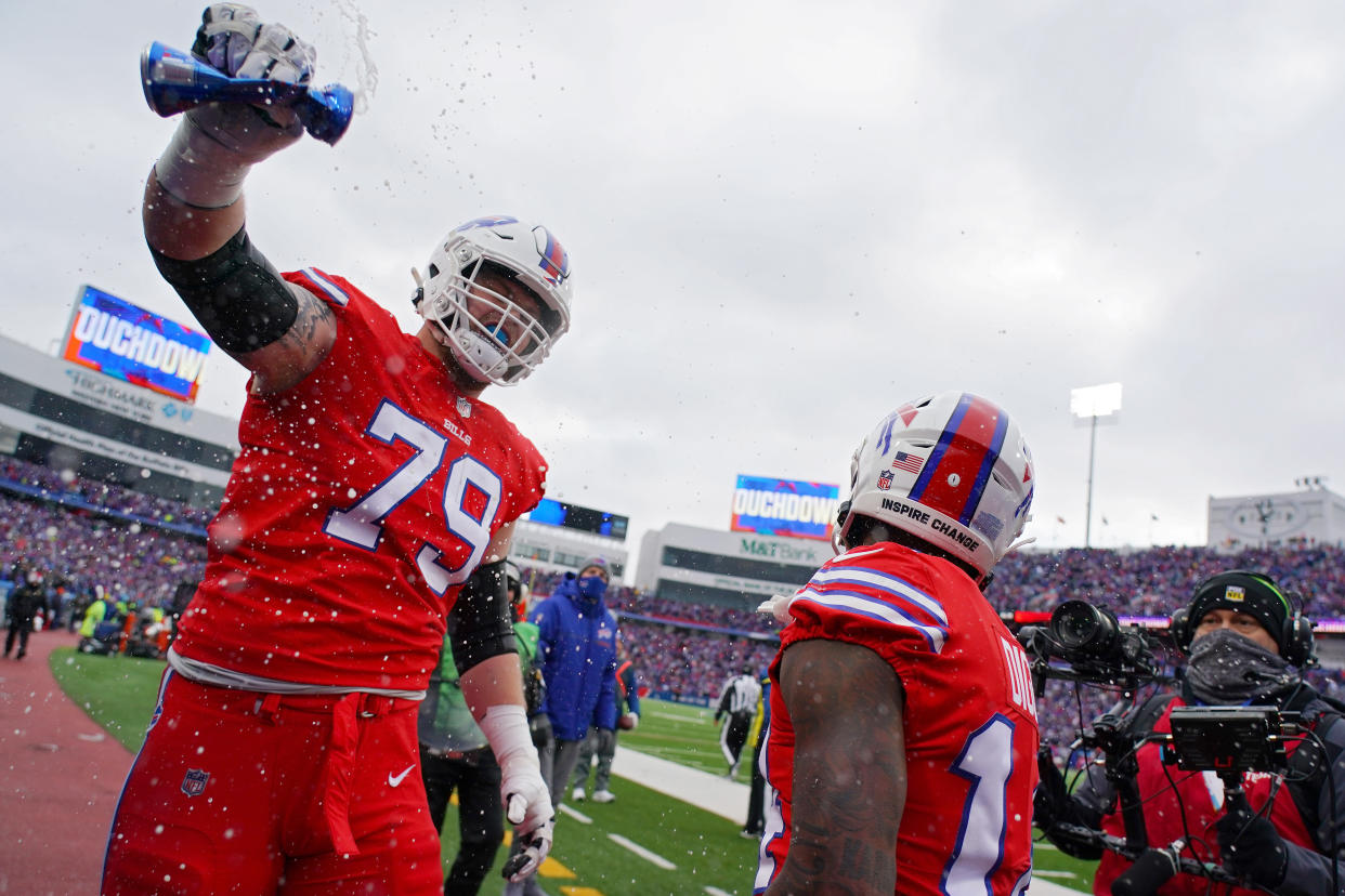 ORCHARD PARK, NEW YORK - DECEMBER 19: Stefon Diggs #14 of the Buffalo Bills celebrates his touchdown with teammate Spencer Brown #79 in the second quarter over the Carolina Panthers at Highmark Stadium on December 19, 2021 in Orchard Park, New York. (Photo by Kevin Hoffman/Getty Images)