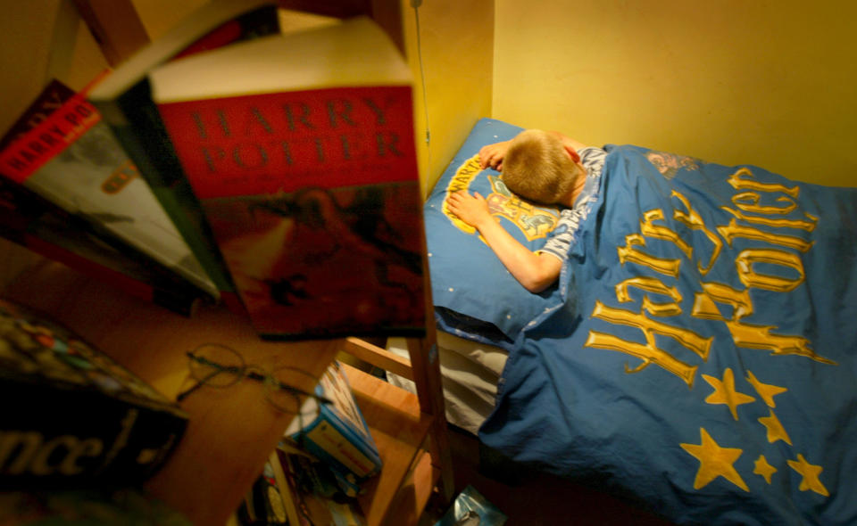 Boy sleeps in Harry Potter bedsheets. Source: Reuters