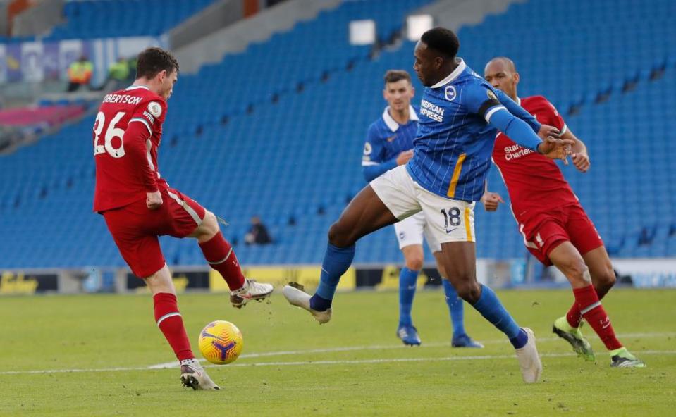 Andy Robertson makes contact with the foot of Brighton’s Danny Welbeck. A penalty was awarded for Brighton after VAR intervention.