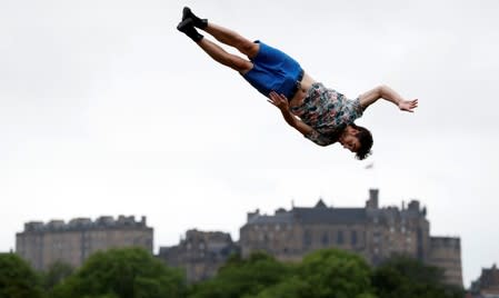 Jarno Polhuijs a member of the cast of Super Sunday is airbourne above Edinburgh Castle