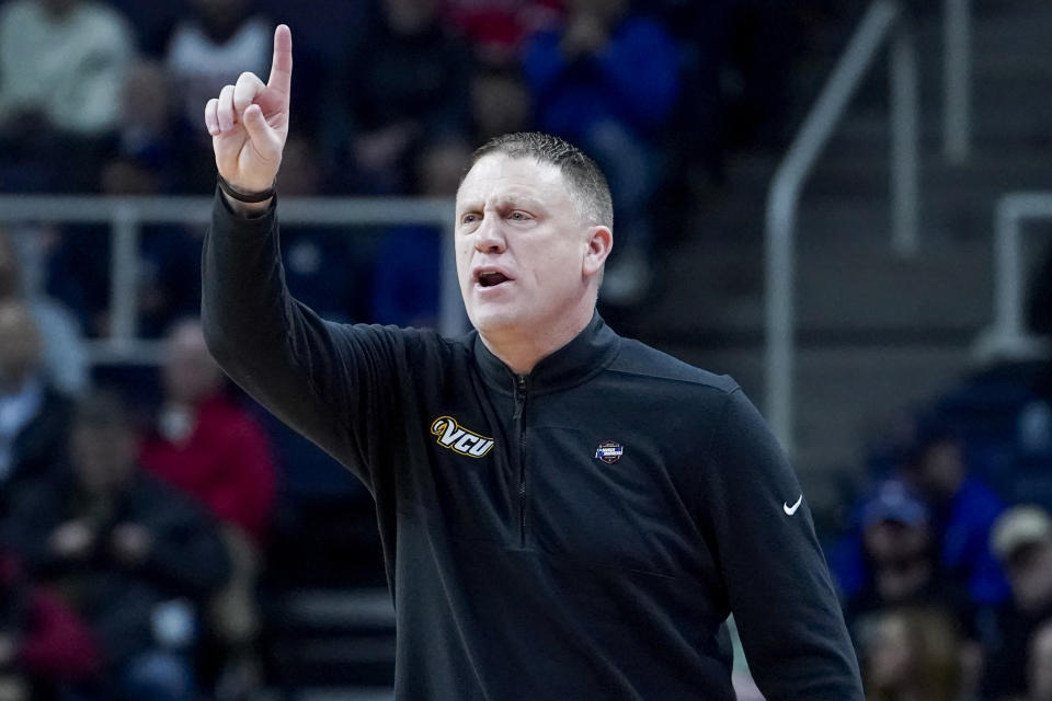 Virginia Commonwealth head coach Mike Rhoades works the bench in the first half of a first-round college basketball game against St. Mary&#39;s in the NCAA Tournament, Friday, March 17, 2023, in Albany, N.Y. (AP Photo/John Minchillo)