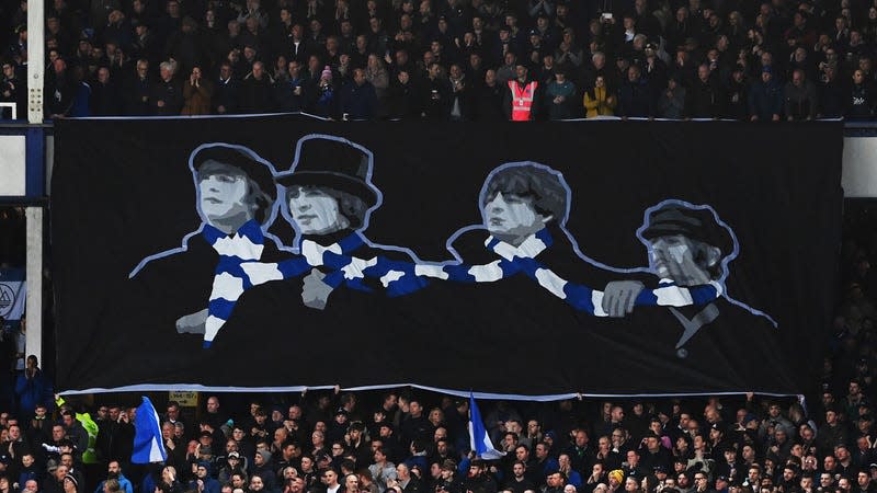 A photo of a Beatles banner at a soccer game.