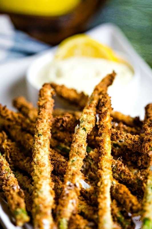 <p>Life, Love and Good Food</p><p>Air fryer asparagus fries with lemon aioli. Fresh asparagus spears coated with a mixture of Panko and Italian-seasoned bread crumbs are air fried with a very light spritz of cooking spray.</p><p><strong>Get the recipe: <a href="https://lifeloveandgoodfood.com/air-fryer-asparagus-fries-with-lemon-aioli/" rel="nofollow noopener" target="_blank" data-ylk="slk:Air Fryer Asparagus Fries with Lemon Aioli;elm:context_link;itc:0;sec:content-canvas" class="link ">Air Fryer Asparagus Fries with Lemon Aioli</a></strong></p>