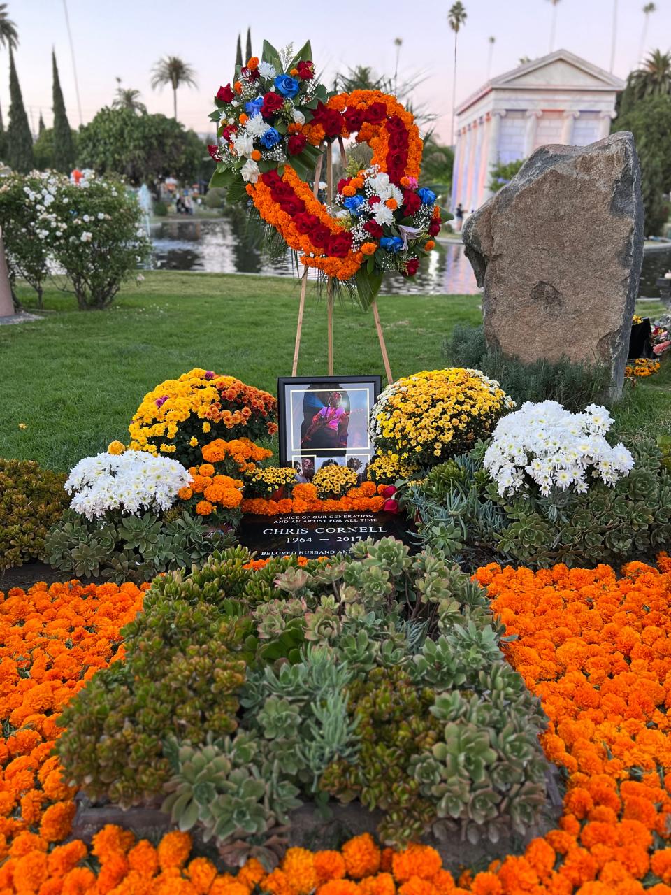 Flowers decorate the gravesite of rocker Chris Cornell during the Día de Los Muertos celebration at the Hollywood Forever Cemetery in Los Angeles on Saturday, Oct. 28, 2023.