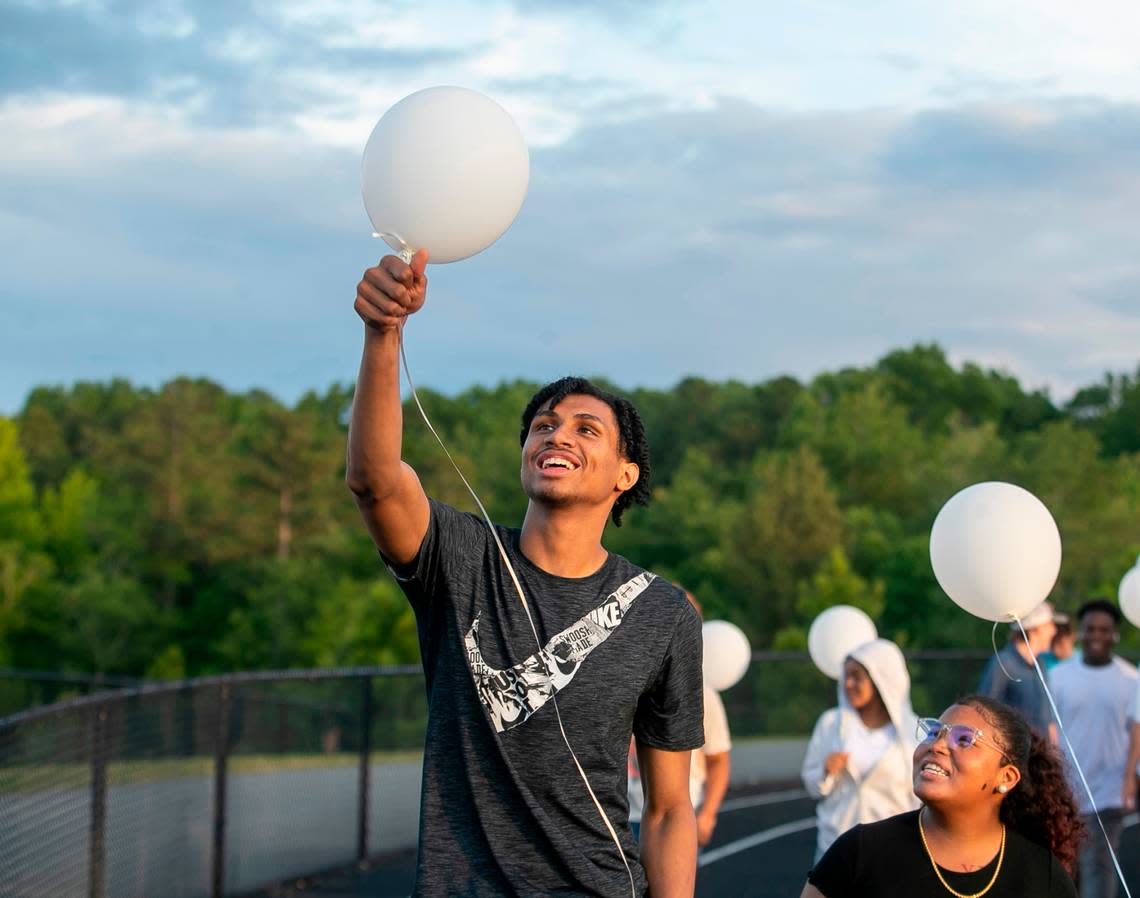 Jarin Stevenson prepares to release a balloon with his classmates during a ‘Rise Up’ celebration for the junior class at Seaforth High School on Thursday, June 1, 2023 in Pittsboro, N.C. The group will become the first senior class at the new high school in Chatham County. Stevenson a highly recruited basketball player completed all of his studies early, will forgo his senior year and enroll at the University of Alabama.