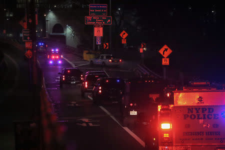 A convoy of law enforcement vehicles transporting Joaquin Guzman, the Mexican drug lord known as "El Chapo", crosses the Brooklyn Bridge heading to the Brooklyn Federal Courthouse for his trial in the Brooklyn borough of New York, U.S., February 11, 2019. REUTERS/Brendan McDermid.