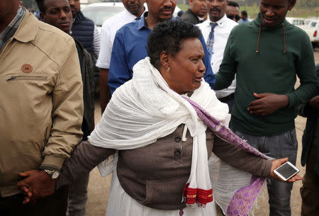 A woman reacts at the scene, where Ethiopia's Grand Renaissance Dam Project Manager Simegnew Bekele was found dead in his car in Addis Ababa, Ethiopia July, 26, 2018 REUTERS/Tiksa Negeri