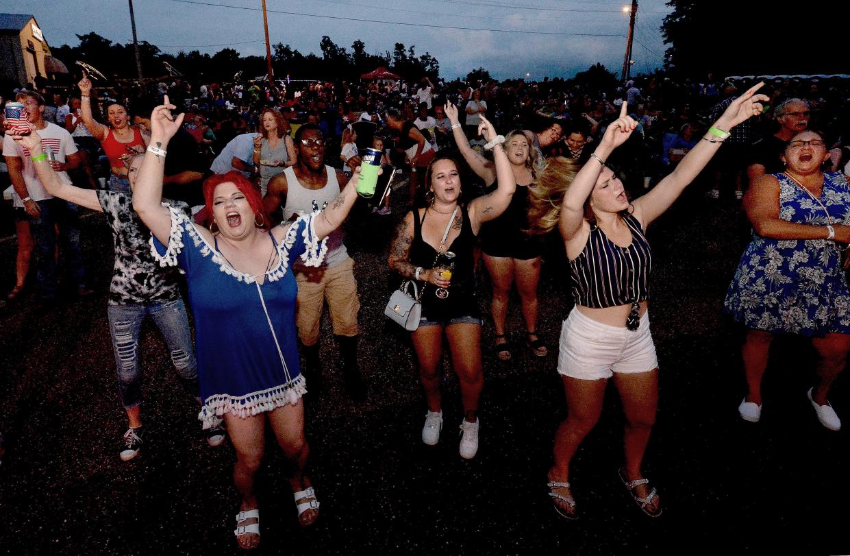 The crowd reacts to the band during Rock the Dock at Springfield Lake Friday July 1, 2022.