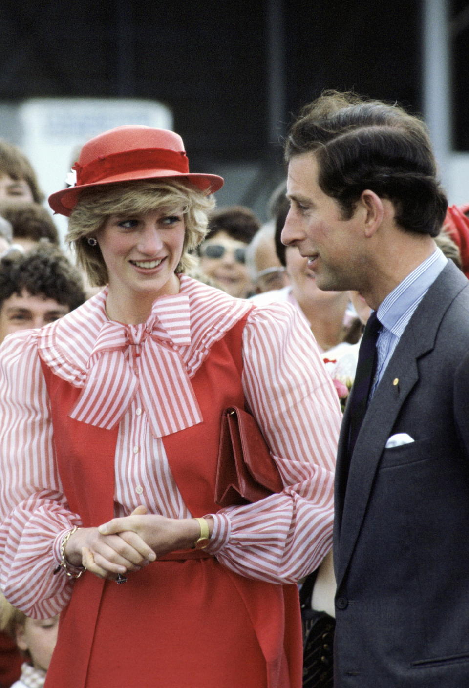 <p>This is a lot of look, but it’s one of the first times we see Diana taking a style risk — in a red-and-white-striped pussy blouse topped with a Bellville Sassoon red dress. No one even noticed Charles on the couple’s Australia visit. (Photo: Tim Graham/Getty Images) </p>