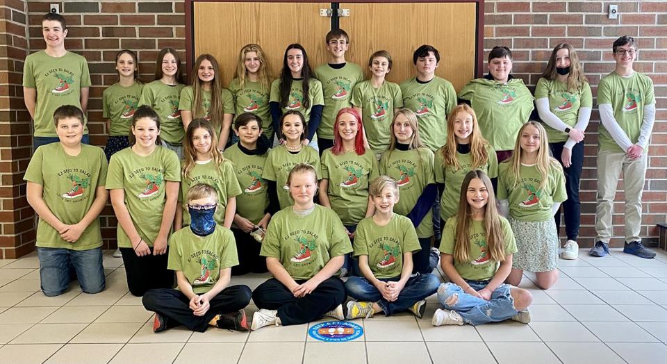 Members of the East Jordan Middle School Shoe Club along with high school mentors who just embarked on this year's 'Seed to Salad' project to enhance the elementary school garden.