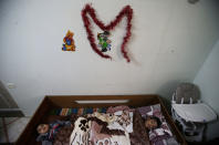 <p>Palestinian boys Mohammed al-Bayed (R), 13, and Amjad Bahar, 4, who suffer from cerebral palsy, lie on a a bed at Mabaret Falasteen charity in Gaza City, March 20, 2017. (Photo: Mohammed Salem/Reuters) </p>