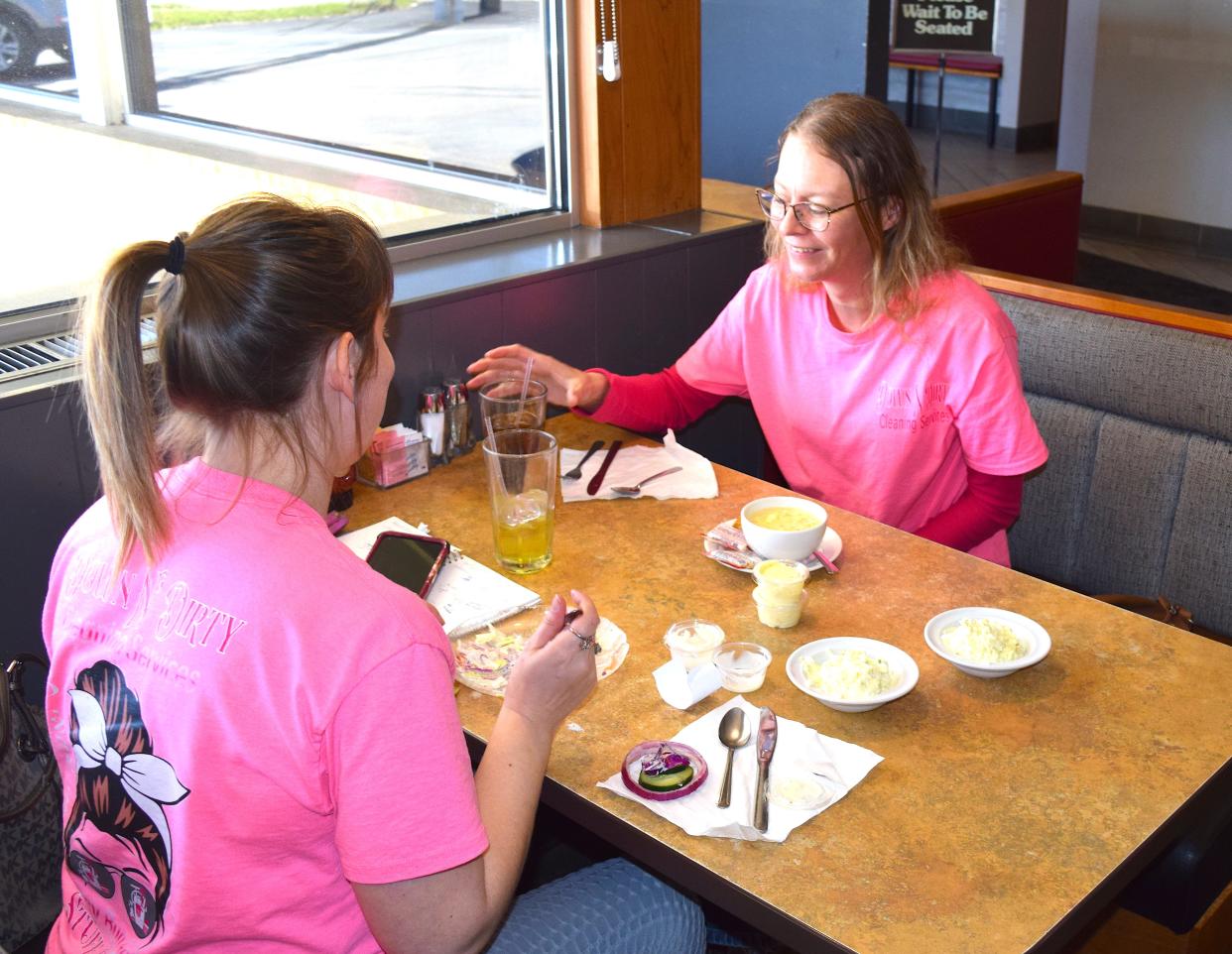 Jaimie Hilderbrand (left) and Ashley Griffitts enjoy lunch at The Green Leaf Restaurant on Wooster.