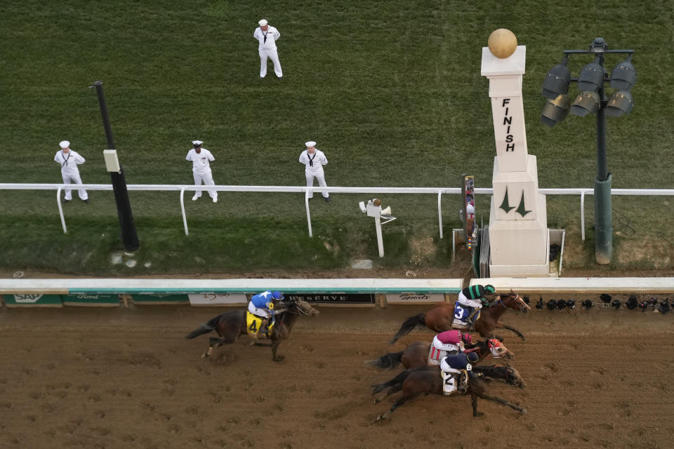 Brian Hernandez Jr. rides Mystik Dan, top right, to the finish line to win the 150th running of the Kentucky Derby horse race at Churchill Downs Saturday, May 4, 2024, in Louisville, Ky. (AP Photo/Charlie Riedel)