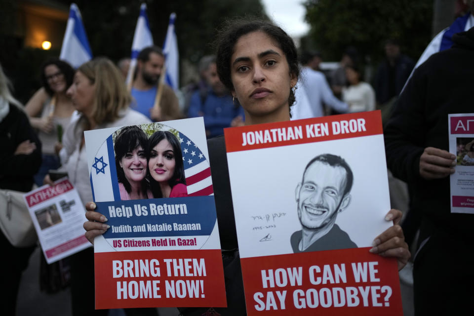FILE - A woman takes part in a rally in solidarity with Israel, outside the Israeli Embassy in Athens, Greece, on Oct. 18, 2023. Antisemitism is spiking across Europe after Hamas' Oct. 7 massacre and Israel's bombardment of Gaza, worrying Jews from London to Geneva and Berlin. (AP Photo/Thanassis Stavrakis, File)