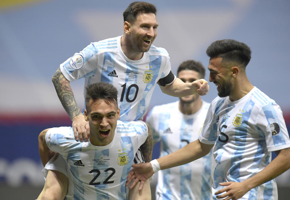 Lio Messi celebrates with Argentine teammates