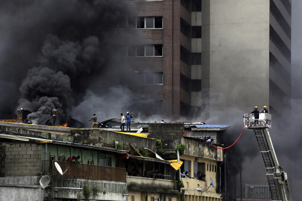 Smoke rises from a fire in downtown Lagos, Nigeria, Tuesday, Nov. 5, 2019. (Photo: Sunday Alamba/AP)