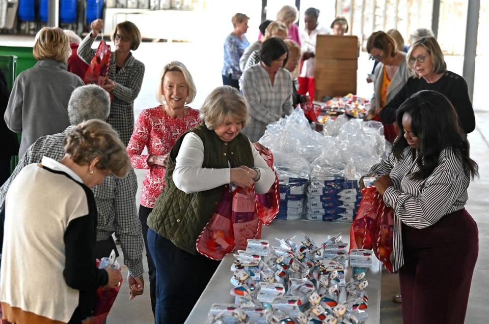 The Salvation Army of Greater Charlotte’s annual Angel Tree program has begun. It provides toys for children in need, and the Observer’s Empty Stocking Fund covers additional needed expenses. Seen here, the Salvation Army Women’s Auxiliary group met for a stocking-stuffing event Nov. 10.