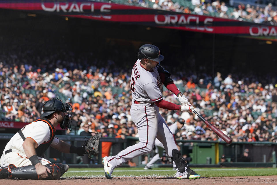 Arizona Diamondbacks' Christian Walker (53) hits an RBI double against the San Francisco Giants during the seventh inning of a baseball game in San Francisco, Saturday, Oct. 1, 2022. (AP Photo/Godofredo A. Vásquez)