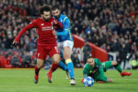 Soccer Football - Champions League - Group Stage - Group C - Liverpool v Napoli - Anfield, Liverpool, Britain - December 11, 2018 Liverpool's Mohamed Salah in action with Napoli's Raul Albiol and David Ospina Action Images via Reuters/Carl Recine