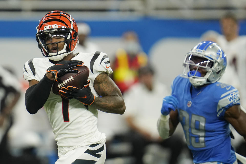 Cincinnati Bengals wide receiver Ja'Marr Chase (1) makes a reception as Detroit Lions cornerback Jerry Jacobs (39) gives chase during the second half of an NFL football game, Sunday, Oct. 17, 2021, in Detroit. (AP Photo/Paul Sancya)